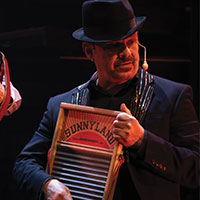 A man playing a washbaord
