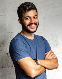 Image of trainer Seth. Short black hair, medium complexion, blue shirt